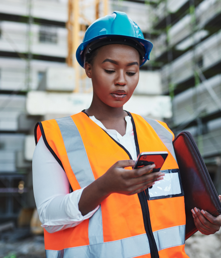 Construction worker holding a phone